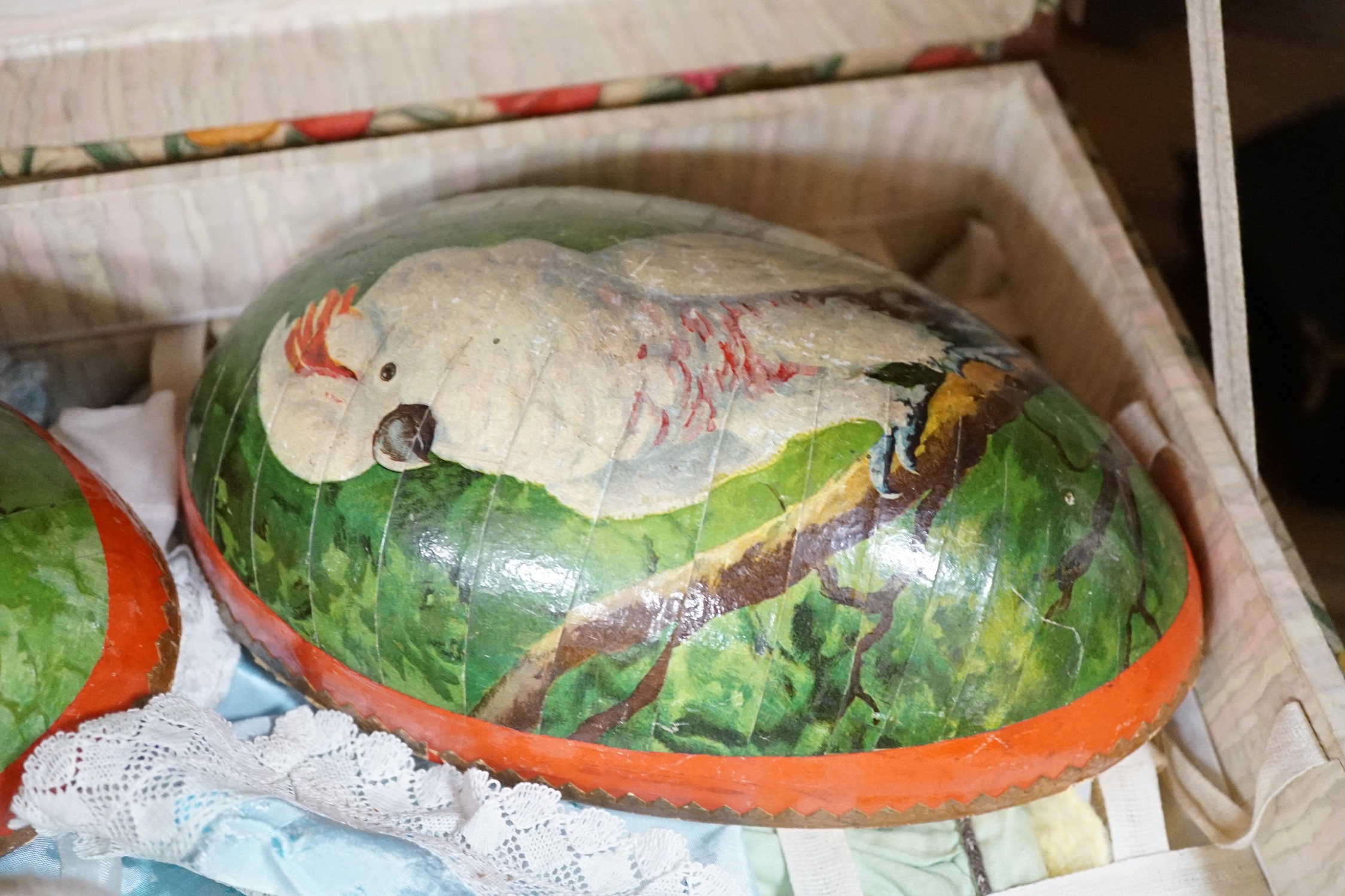 A doll's trunk containing three dolls including an Armand Marseille 341 and clothing
